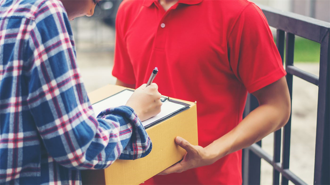 Young man Delivering Package to customer at home. Delivery